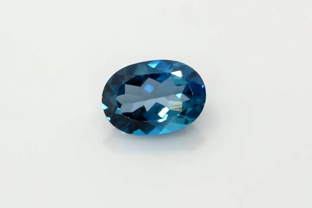 10.46ct Oval Natural Topaz (Colour Bicolor, Clarity Slightly Included, Cut Faceted)